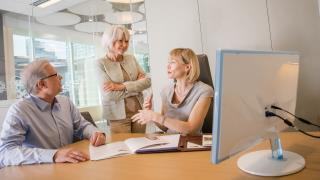 Wells Fargo Advisors Financial Advisor consulting with clients